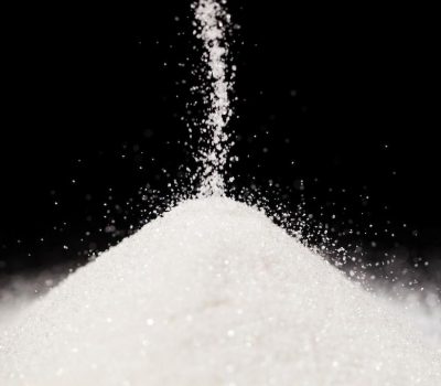 The sugar lies on the black background